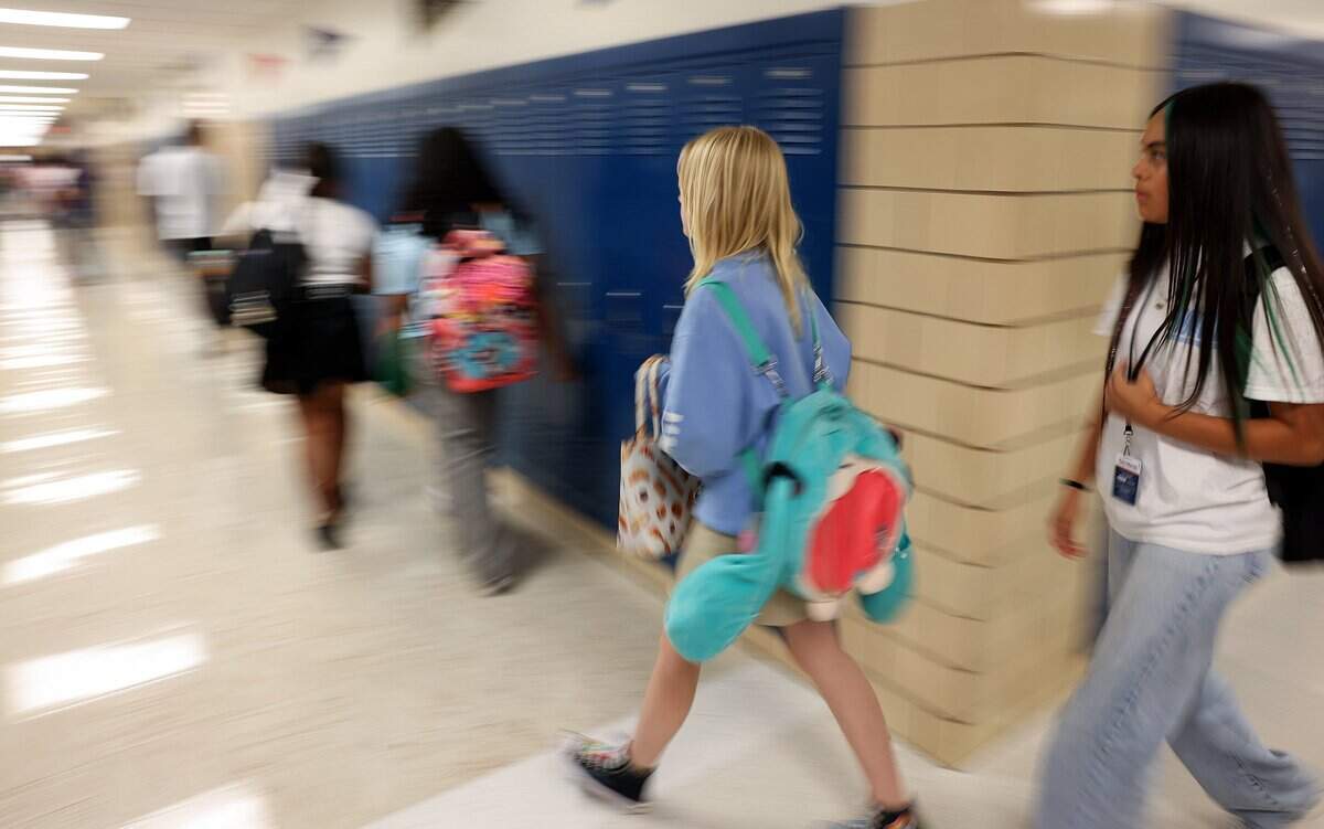 Students at William Monnig Middle School transition to their next class on Friday, Aug. 14, 2026, in Fort Worth. The school is part of the Elevate Network.